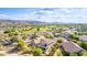 Aerial view of a residential area with golf course, mountain backdrop showcasing community charm at 6847 S 27Th Pl, Phoenix, AZ 85042