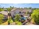 Aerial view of a home's backyard featuring a pool, spa, covered patio, putting green, and desert landscaping at 6847 S 27Th Pl, Phoenix, AZ 85042