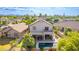 Backyard aerial view showcasing a private pool, outdoor patio, putting green, and lush tropical landscaping at 6847 S 27Th Pl, Phoenix, AZ 85042