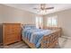 Comfortable bedroom with natural light, ceiling fan, and stylish decor at 6847 S 27Th Pl, Phoenix, AZ 85042