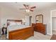 Bedroom with hardwood floors, ceiling fan, and dresser at 6847 S 27Th Pl, Phoenix, AZ 85042