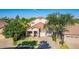 Home's exterior view features lush landscaping, mature trees, and a well-manicured lawn at 6847 S 27Th Pl, Phoenix, AZ 85042