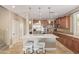 Modern kitchen featuring a center island, quartz countertops, and stainless steel appliances at 6847 S 27Th Pl, Phoenix, AZ 85042