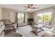 Cozy living room featuring a comfortable seating area and sliding glass doors at 6847 S 27Th Pl, Phoenix, AZ 85042