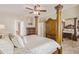 Spacious main bedroom with elegant pillars, ceiling fan, and ensuite bath at 6847 S 27Th Pl, Phoenix, AZ 85042