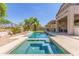Backyard view of a sparkling in-ground pool with a spa and lush landscaping for outdoor enjoyment at 6847 S 27Th Pl, Phoenix, AZ 85042