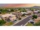 Beautiful aerial view of a well-maintained suburban neighborhood featuring lush landscaping and sidewalks at 6971 W El Cortez Pl, Peoria, AZ 85383