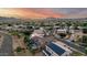 Breathtaking aerial view capturing the beauty of the lush neighborhoods, sidewalks and distant mountain views at 6971 W El Cortez Pl, Peoria, AZ 85383