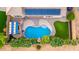 Aerial view of a backyard featuring a pool, spa, and desert landscaping at 6971 W El Cortez Pl, Peoria, AZ 85383