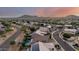 Aesthetic aerial view showcasing lush trees, sidewalks, and houses at 6971 W El Cortez Pl, Peoria, AZ 85383