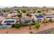 Suburban home with a pool, solar panels, manicured landscaping, and beautiful neighborhood views at 6971 W El Cortez Pl, Peoria, AZ 85383