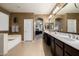 Elegant primary bathroom featuring double vanity, soaking tub, and natural light for luxurious living at 6971 W El Cortez Pl, Peoria, AZ 85383