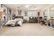 Spacious bedroom with plush carpet, neutral walls, large window and a queen bed at 6971 W El Cortez Pl, Peoria, AZ 85383