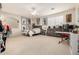 Spacious bedroom featuring plush carpet, neutral paint, a fan and large windows at 6971 W El Cortez Pl, Peoria, AZ 85383