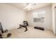Versatile bedroom featuring carpet flooring, a ceiling fan, and natural light, perfect for various activities at 6971 W El Cortez Pl, Peoria, AZ 85383