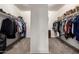 Spacious walk-in closet with ample hanging space and shelving for organized storage at 6971 W El Cortez Pl, Peoria, AZ 85383