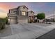 Beautiful home with a three-car garage, a spacious driveway, and a well-maintained yard at 6971 W El Cortez Pl, Peoria, AZ 85383