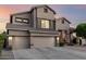 A charming home featuring a convenient three-car garage and a lovely tiled roof at 6971 W El Cortez Pl, Peoria, AZ 85383