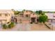 A two-story home with a three-car garage and well-maintained front yard at 6971 W El Cortez Pl, Peoria, AZ 85383