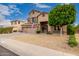 Charming two-story home with a three car garage, beautiful landscaping, and inviting curb appeal at 6971 W El Cortez Pl, Peoria, AZ 85383