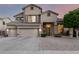 Charming two-story home boasting a three-car garage and inviting curb appeal at 6971 W El Cortez Pl, Peoria, AZ 85383