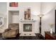 Close-up of the fireplace with tile surround and mantel at 6971 W El Cortez Pl, Peoria, AZ 85383