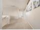 Bright hallway featuring carpet flooring, neutral walls, and natural light, perfect for a welcoming atmosphere at 6971 W El Cortez Pl, Peoria, AZ 85383