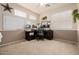 Spacious office space with neutral paint, plush carpet, windows, desk and office chair at 6971 W El Cortez Pl, Peoria, AZ 85383