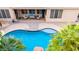 Aerial view of a backyard pool and outdoor living space at 6971 W El Cortez Pl, Peoria, AZ 85383