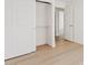 Bedroom with light wood floors and an open closet at 732 W Sagebrush St, Gilbert, AZ 85233