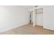 Bedroom with light wood floors and an open closet at 732 W Sagebrush St, Gilbert, AZ 85233