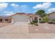 Charming single-story home with a well-manicured front yard and attached two-car garage at 732 W Sagebrush St, Gilbert, AZ 85233