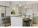 A modern kitchen showcases stainless steel appliances, quartz countertops, an island with seating, and lots of natural light at 732 W Sagebrush St, Gilbert, AZ 85233