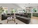 Spacious living room offering modern finishes, a large sectional, and a view into the bright kitchen at 732 W Sagebrush St, Gilbert, AZ 85233