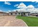 Spacious backyard featuring artificial grass, a patio, and a unique pizza oven at 738 S Pomeroy --, Mesa, AZ 85210
