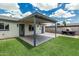 Backyard featuring a covered patio, artificial grass, and a pizza oven at 738 S Pomeroy --, Mesa, AZ 85210
