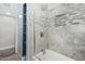 Modern bathroom featuring gray tiled walls, shower over bath, and sleek fixtures at 738 S Pomeroy --, Mesa, AZ 85210