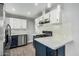 Updated kitchen with white cabinets, granite countertops and stainless steel appliances at 738 S Pomeroy --, Mesa, AZ 85210