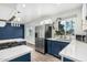 Kitchen featuring stainless steel appliances, white countertops, blue cabinets and tiled backsplash at 738 S Pomeroy --, Mesa, AZ 85210