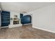 Spacious living room with tiled floors, white brick fireplace with open shelving at 738 S Pomeroy --, Mesa, AZ 85210