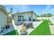 Outdoor patio area with dining furniture, artificial grass, and privacy fencing at 7524 N Via Del Elemental --, Scottsdale, AZ 85258