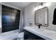 Modern bathroom featuring contrasting dark tiled shower and marble countertop at 7524 N Via Del Elemental --, Scottsdale, AZ 85258