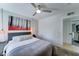 Cozy bedroom with pendant lighting, ceiling fan, and doorway to an adjacent room at 7524 N Via Del Elemental --, Scottsdale, AZ 85258