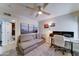 Bright bonus room with a comfortable couch and well lit home office space at 7524 N Via Del Elemental --, Scottsdale, AZ 85258