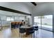 Open dining area next to a gourmet kitchen, with modern table and chairs and sliding door access to the backyard at 7524 N Via Del Elemental --, Scottsdale, AZ 85258