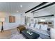 Spacious living room with modern furnishings, a large sectional sofa, and an open view to the kitchen at 7524 N Via Del Elemental --, Scottsdale, AZ 85258
