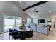 Open-concept living room features dining space, modern furnishings, and bright, natural light at 7524 N Via Del Elemental --, Scottsdale, AZ 85258