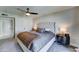 Comfortable main bedroom featuring a tufted headboard and modern ceiling fan at 7524 N Via Del Elemental --, Scottsdale, AZ 85258