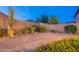 Backyard view features low maintenance desert landscaping at 7606 E Globemallow Ln, Gold Canyon, AZ 85118