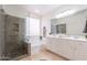 Bathroom featuring a glass shower, soaking tub, double vanity, and window at 7606 E Globemallow Ln, Gold Canyon, AZ 85118